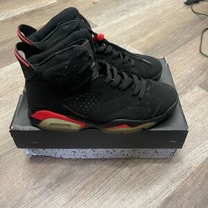 Micheal Jordans Black High-Top Sneakers with Iconic Logo